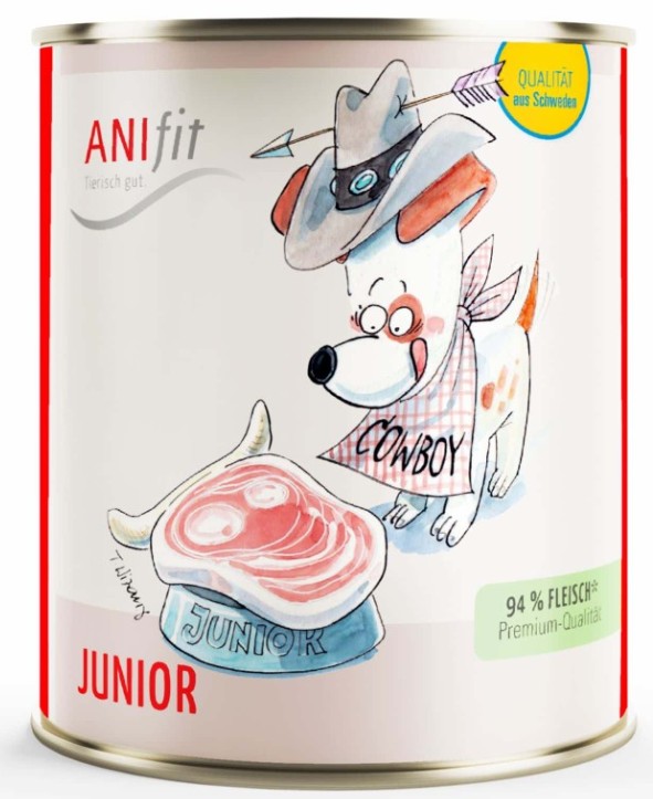 "Junior" ANIfit Hundefutter Monoprotein Hund mit Cowboyhut auf einer Futterdose, neben Fleischstücken. Aufschrift: "ANIfit Junior".