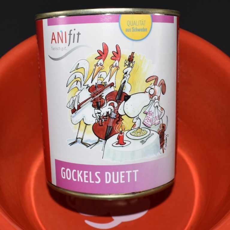 Dose mit dem Etikett "Gockels Duett" von Anifit, rot-orangefarbener Hintergrund.