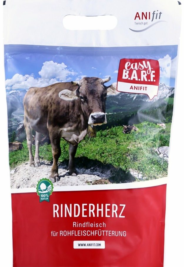 Packung mit Rinderherz für Tiernahrung, abgebildet mit einer Kuh in einer Berglandschaft.